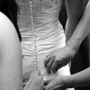 Buttoning the back of Sandy's Wedding  Dress